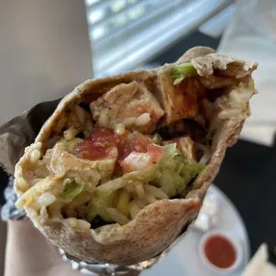 Chicken with rice, lettuce, mild salsa, veggies, sour cream