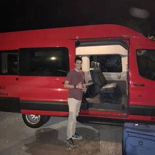 John with his beautiful new 14-passenger van!