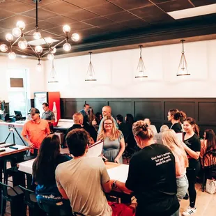 a large group of people sitting around a table