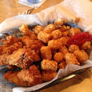 Drummie basket with tator tots. The tots had a little garlic salt on them that made them amazing!  Service was great too.