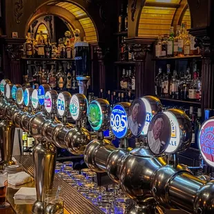 a row of beer taps