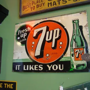 A metal 7 Up sign - late 40s or early 50s.