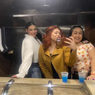 three women taking a selfie