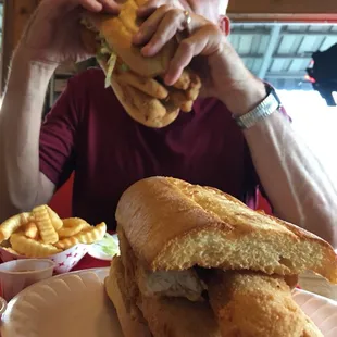 a man eating a sandwich