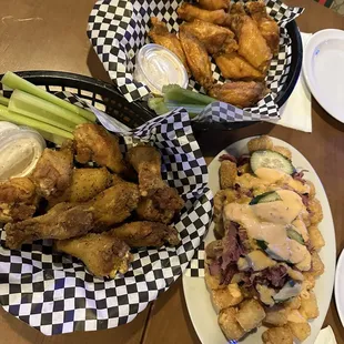 Lemon pepper and buffalo wings with Pastrami Tots!