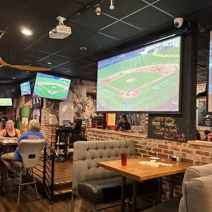 Booths and high top tables w plenty of TVs