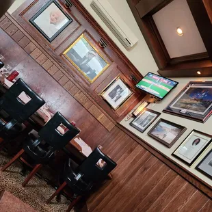 a wall of framed photographs