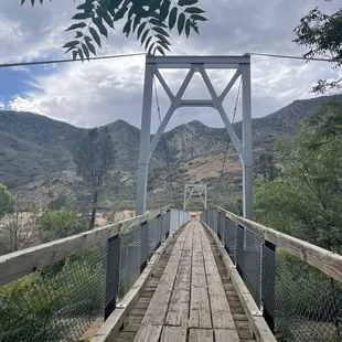 Steel and wood bridge leading to adventure