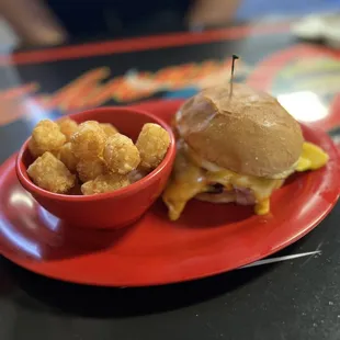 Ham, Egg and Cheese Sandwich with some tater tots