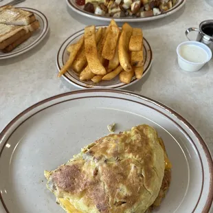 Country omelette, cajun seasoned fries, ham and cheese omelette