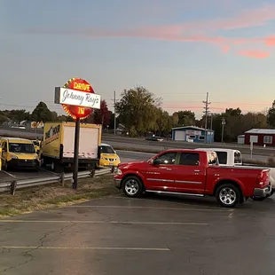 a red truck parked in a parking lot