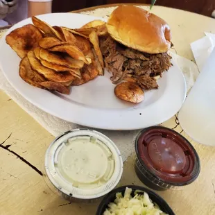 Chopped brisket sandwich, Cole slaw and fried potatoe chips