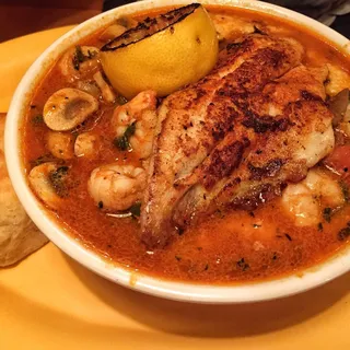 Creole Shrimp over Cheddar Grits, Egg and Bread