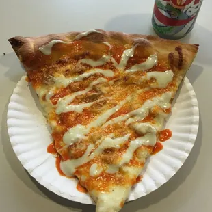 Buffalo chicken pizza slice with blue cheese sauce