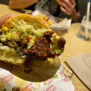 The Original Burger with cheddar smothered in their side of seasoned chili