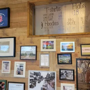 a wall of framed photos