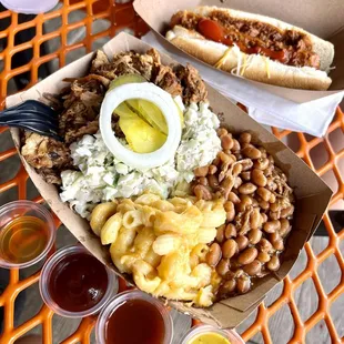 Bbq bowl with coleslaw, Mac and cheese, baked beans, and pickles