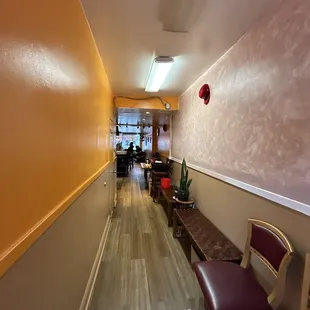 a long hallway with chairs