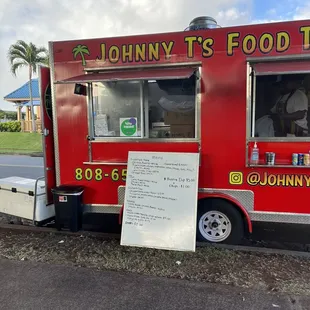 a sign for johnny t's food truck