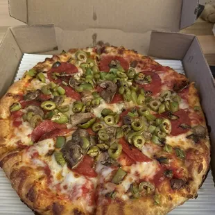 Small pepperoni, fresh mushrooms, green peppers, green olives, and garlic butter crust