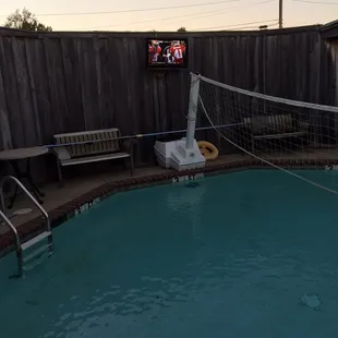 a pool with a volleyball net
