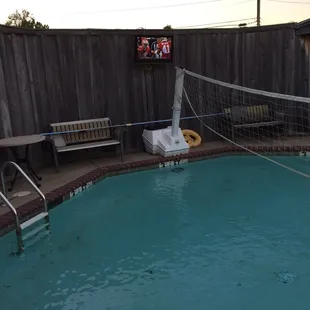 a pool with a volleyball net