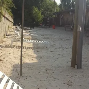 lounge chairs in the sand