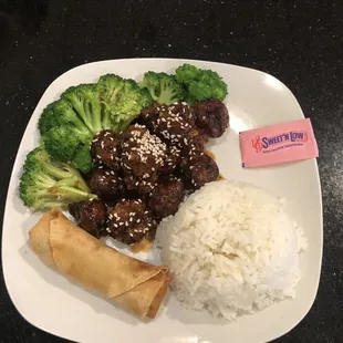Sesame Beef. This is lunch and I put the packet in for scale. Every piece was so succulent. Fresh broccoli and perfect rice.