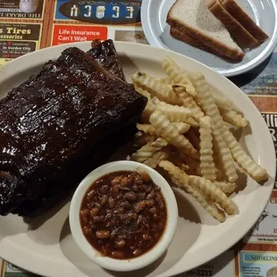 Ribs with fries, baked beans and bread. Was really good