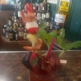 a bloody drink with a gnome garnish