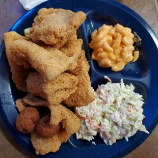 A catfish combo with Mac an cheese an Cole slaw and hushpuppies