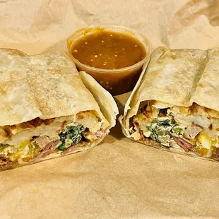 The &quot;Johnny&apos;s&quot; Breakfast Burrito. Delicious! Packed full of Eggs, Cheese, Hashbrowns, Onion, Mushroom, Spinach, Bacon, Sausage, &amp; Ham.