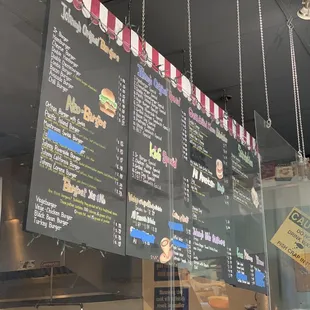 Menu with scribbles and tape covering some items. Would really like to see this get updated and refreshed.