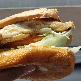 Grilled chicken sandwich held ready to be eaten LOL