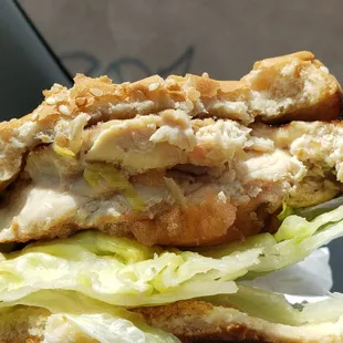 Two bites into grilled chicken sandwich