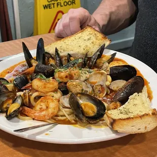 Shrimp, mussels, clams angel hair pasta with marinara.