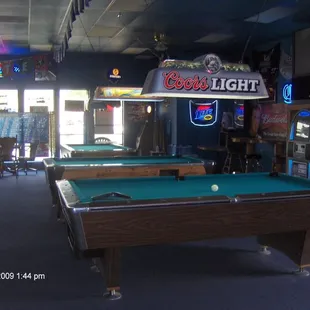 pool tables and neon signs
