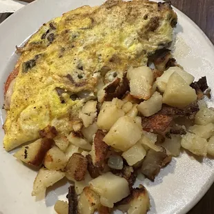Swiss cheese and veggies omelette with home fries