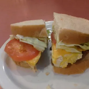 A breakfast sandwich of steak, egg, and cheese.