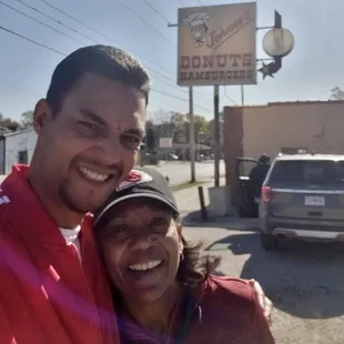 Mother and son at Johnny&apos;s Donuts on Prospect in Kansas City, MO
