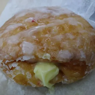 Bavarian creme bismark sticking out its tongue at me