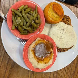 Country style steak, green beans, mashed with brown gravy, and cornbread.