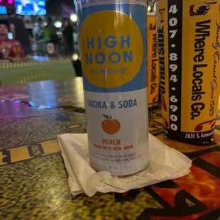  can of soda and a can of peach