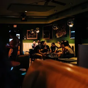 a group of people sitting in a restaurant