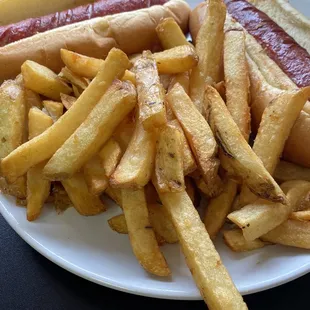 a plate of french fries and a hot dog