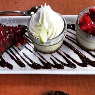 Dessert trio: flourless chocolate cake, key lime pie, strawberry cheesecake