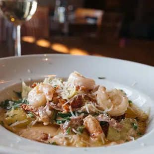 a plate of pasta and shrimp