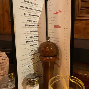 a menu and a glass of water