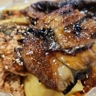 Custom bowl w/cooked eel and spicy raw tuna. The biggest protein portions ever and a deal.