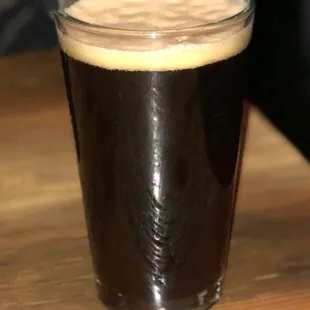 a pint of beer on a table